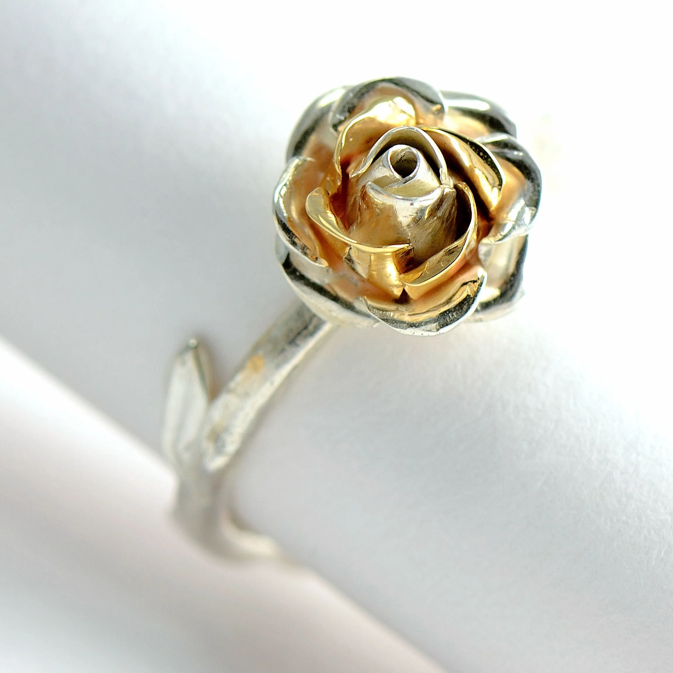 Delicate, small rose ring with a soft rose stem