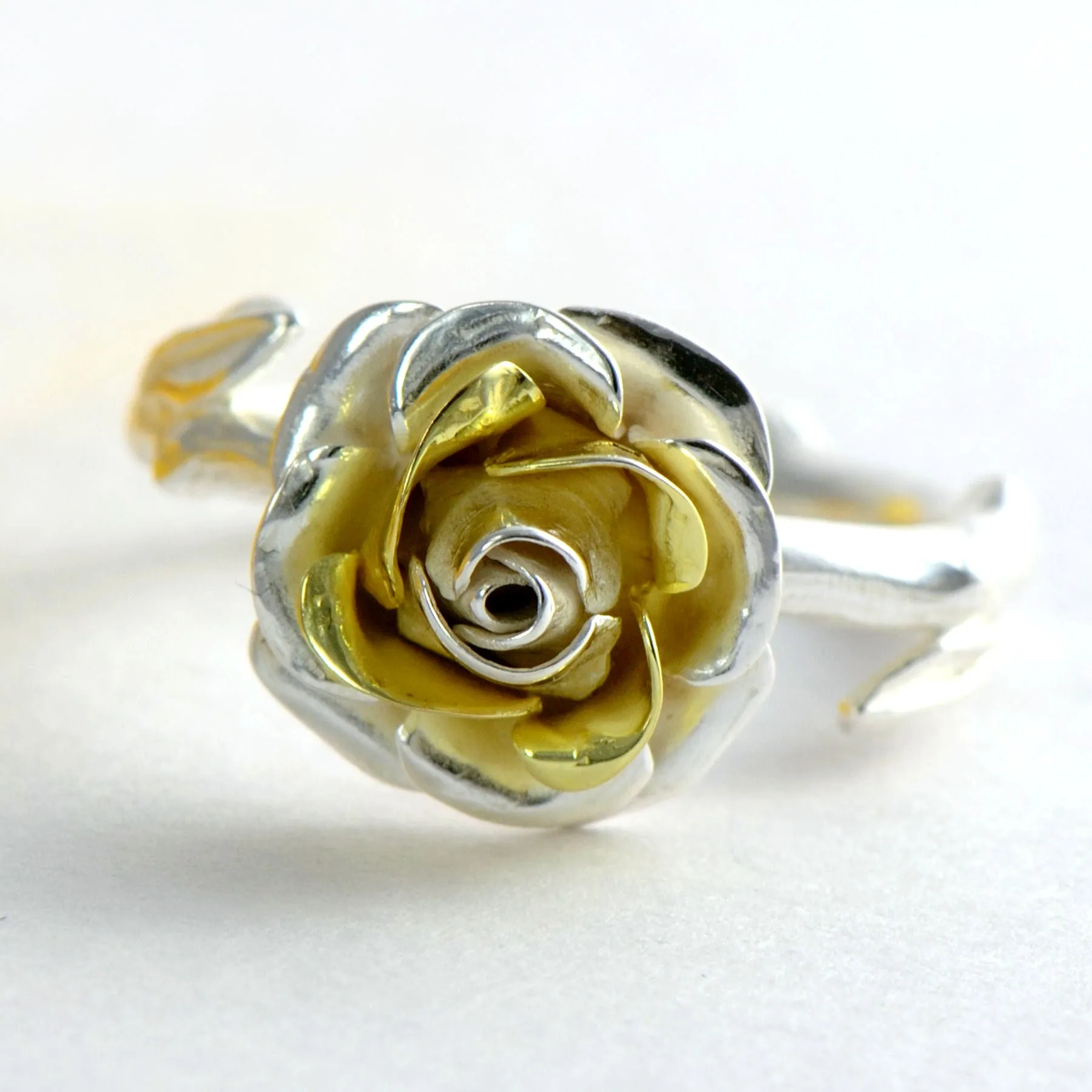Delicate, small rose ring with a soft rose stem