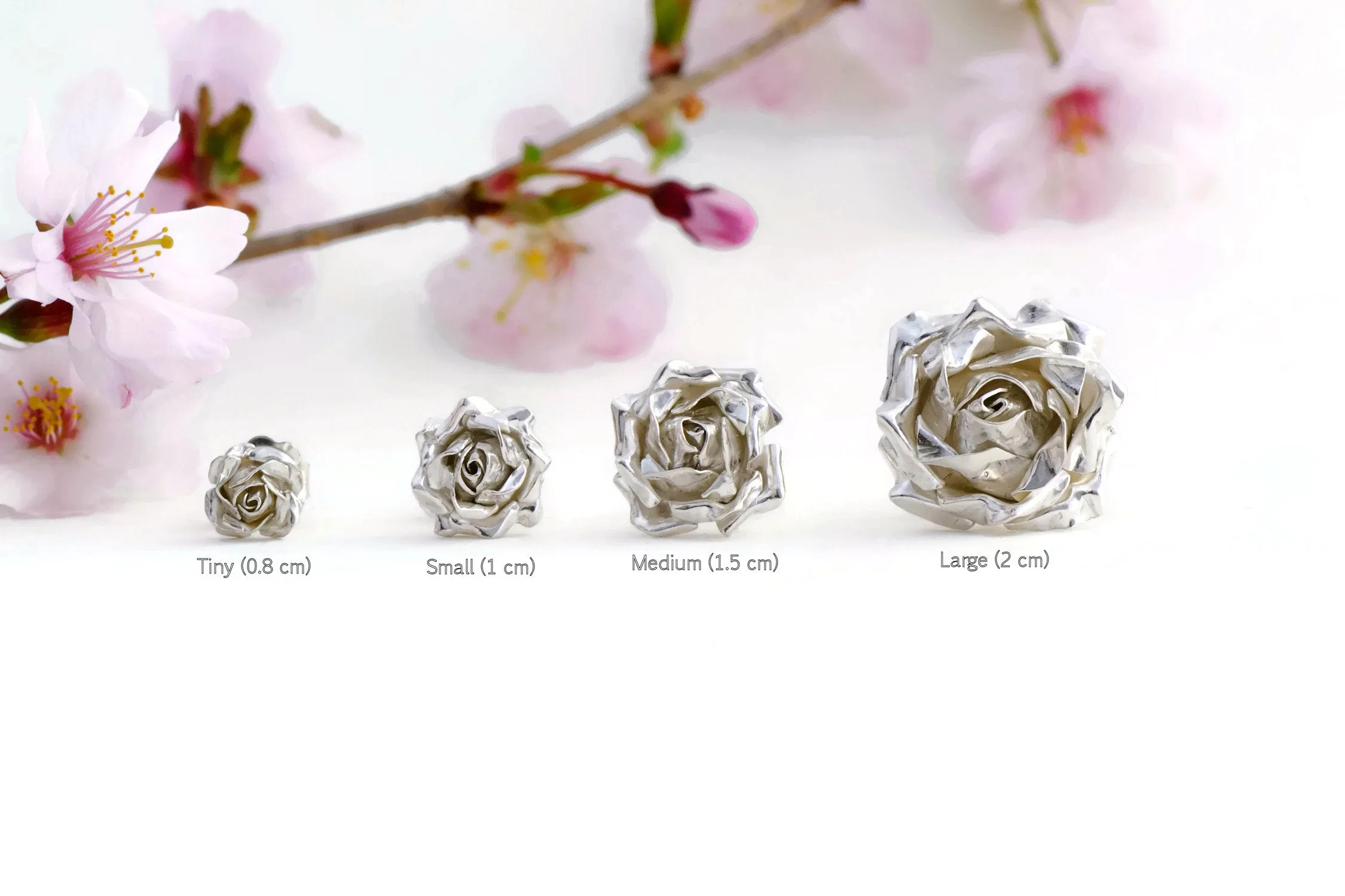 Delicate, small rose ring with a soft rose stem