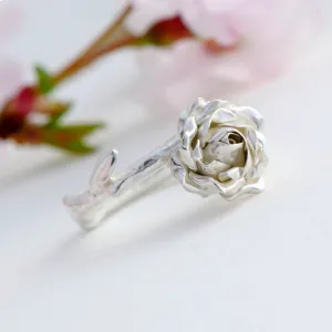 Delicate, small rose ring with a soft rose stem