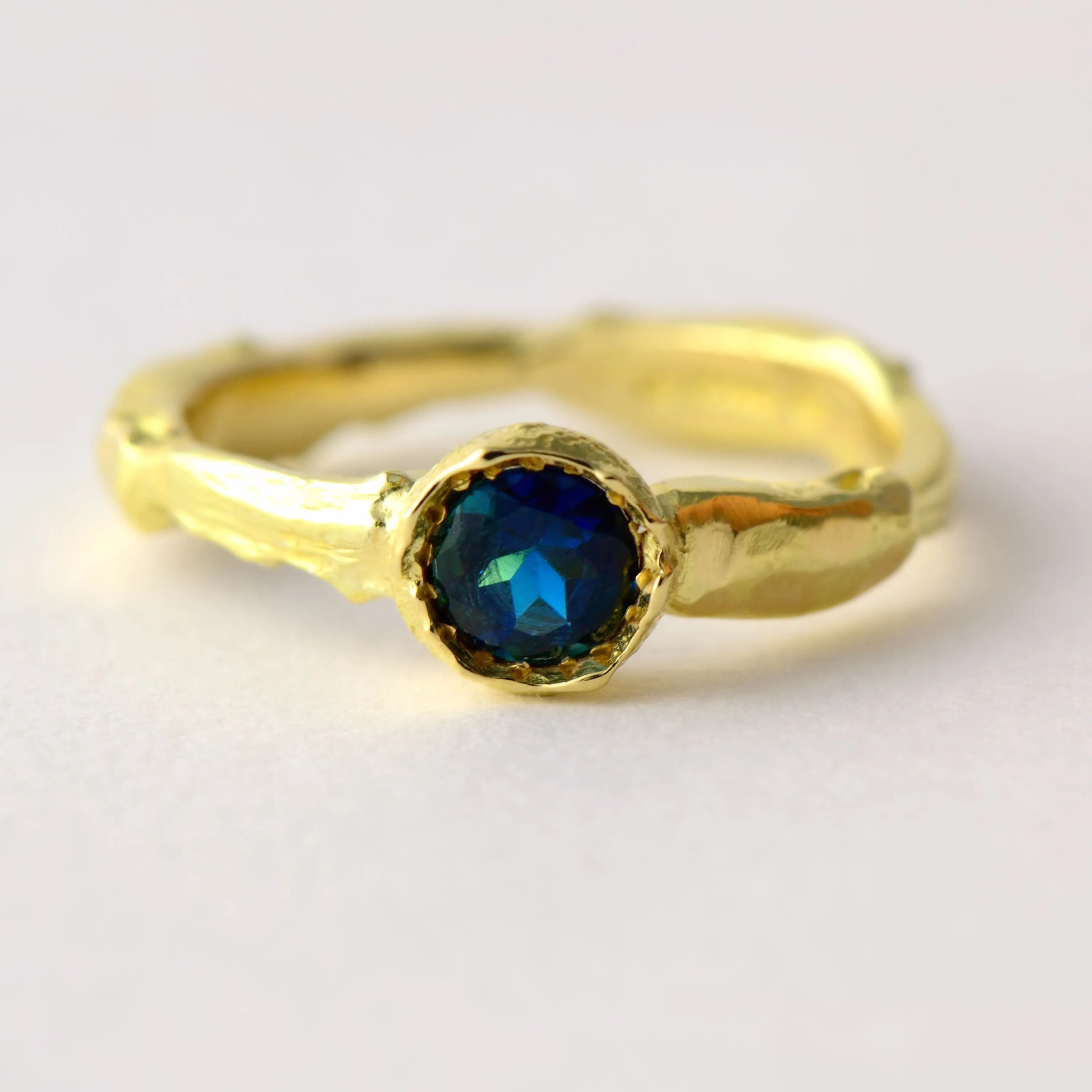 Modern solitaire blue tourmaline solid gold engagement ring - natural texture gold ring – tropical insect-inspired jewellery